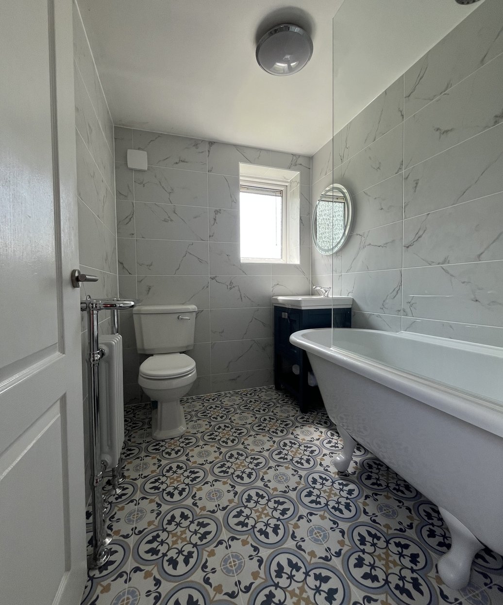 Bathroom renovation with roll-top bath completed by AJB Plumbing & Heating