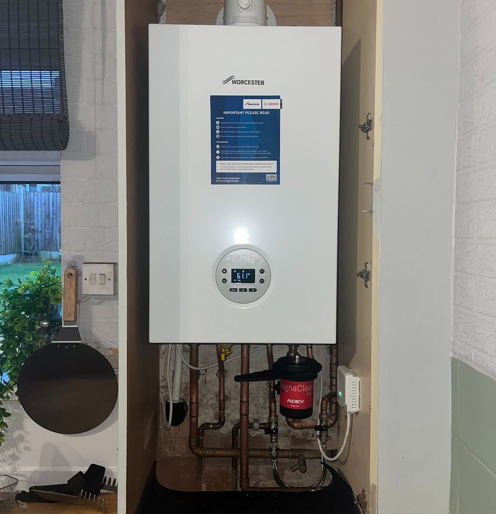 Worcester boiler installed inside a kitchen cupboard
