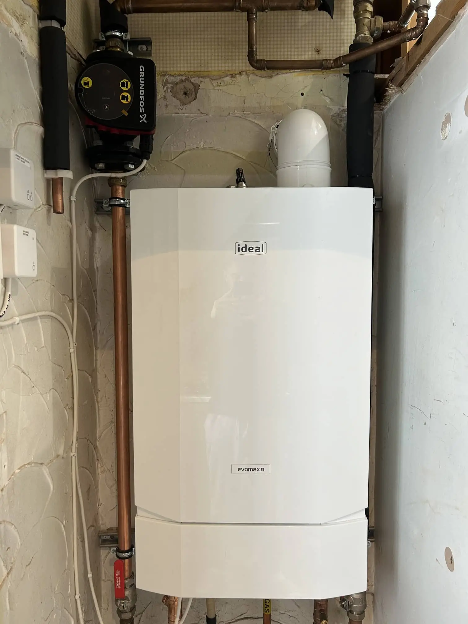 New energy-efficient boiler installed neatly in a Bolton home