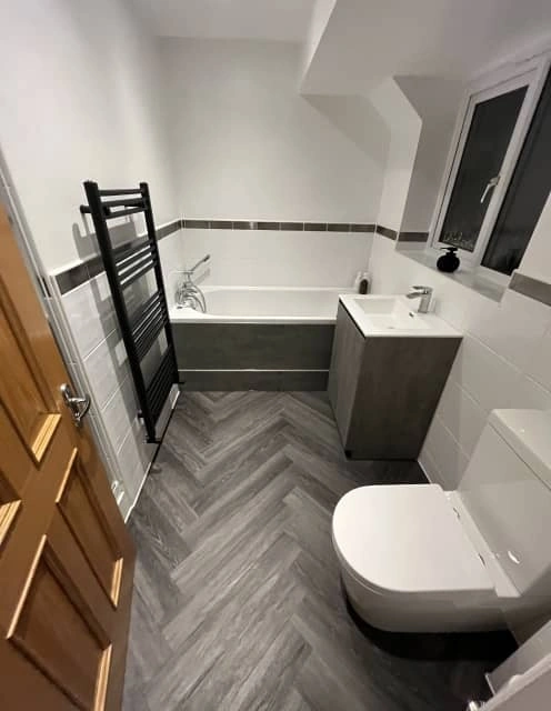 After: Bright and functional bathroom with modern shower and tiling