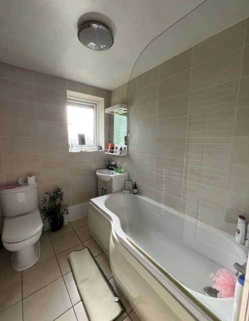 Before: Old bathroom stripped back to bare walls and pipework