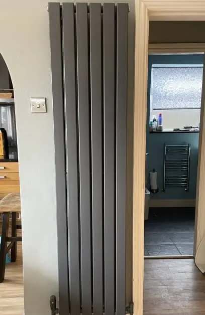 modern grey walled radiator install by AJB Plumbing & Heating
