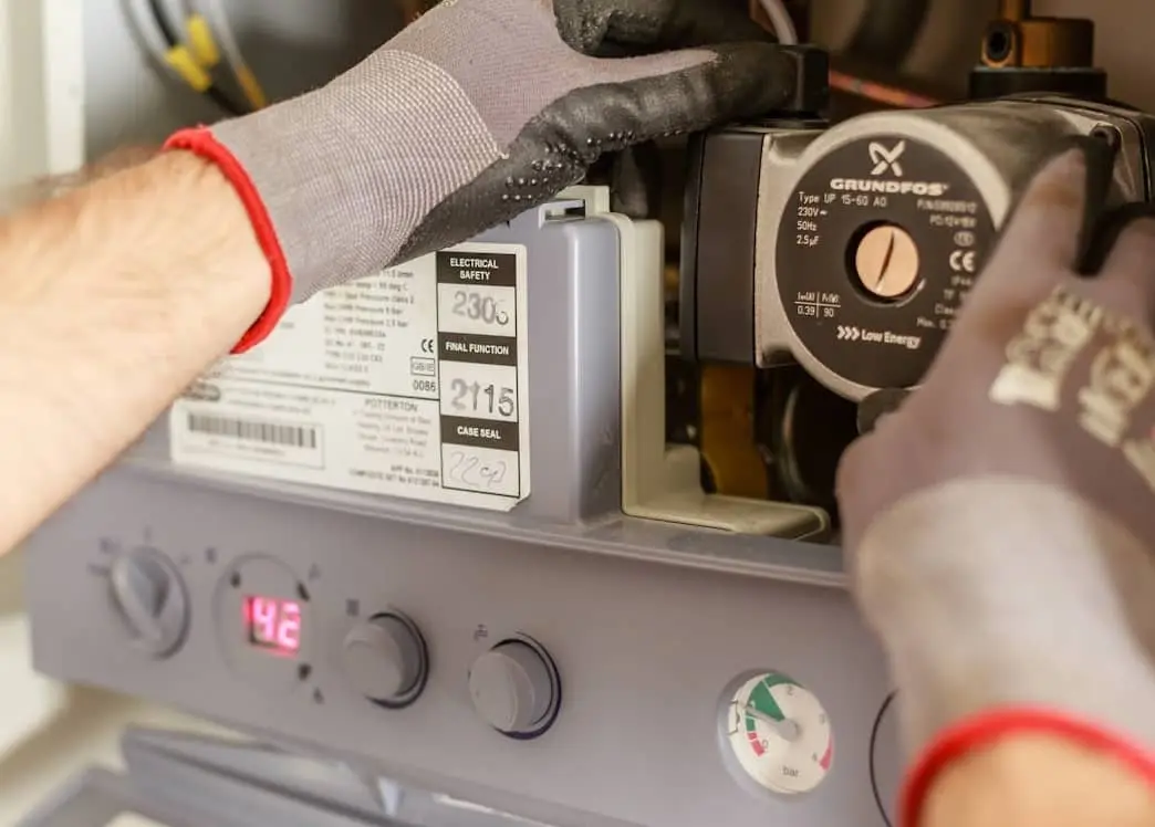 Gas Safe engineer servicing a residential boiler system