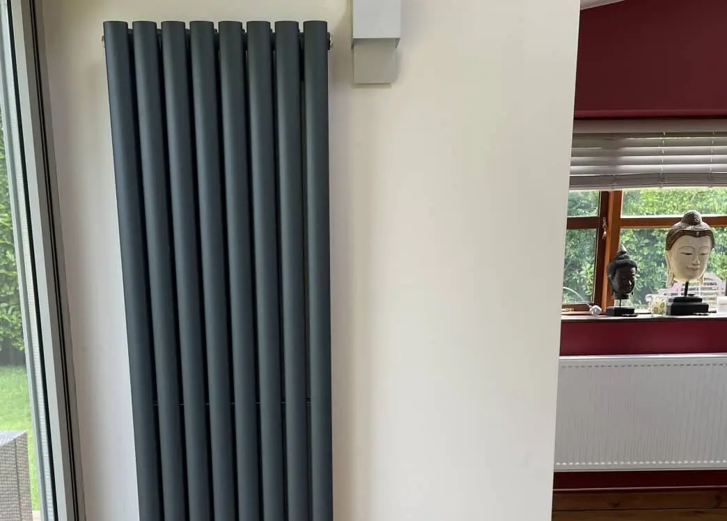 Modern vertical radiator installation in a Bolton home